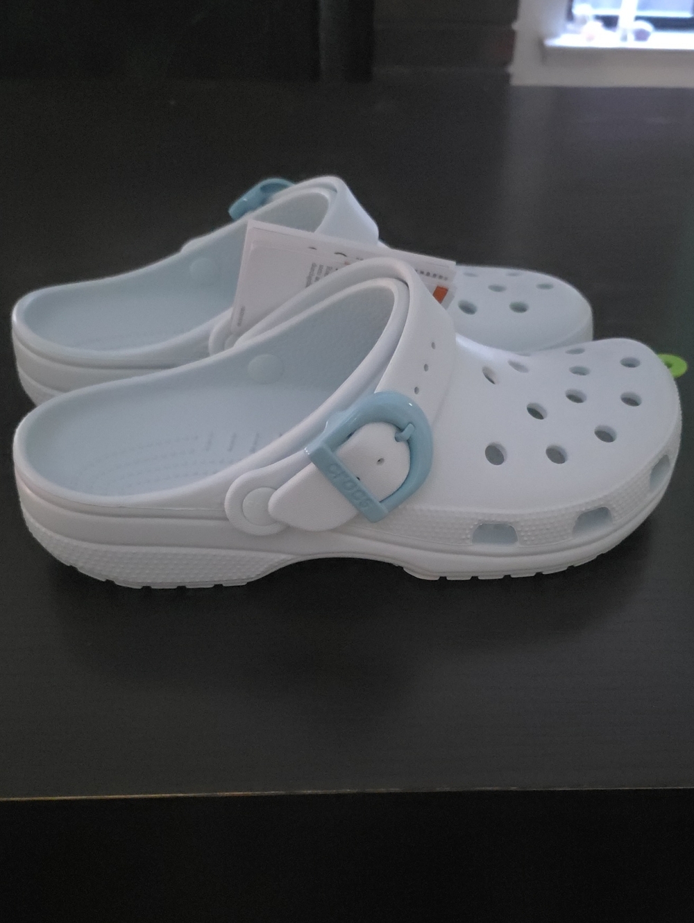 CROCS White Clogs with Light Blue Strap Accent
